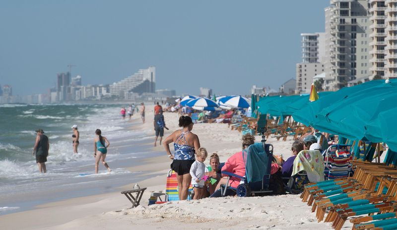 In a move to restrict public access to the beach serveal Perdido Key Condo have begun placing beach chairs with in a few inches of the high tide line and mared off area with black and yellow boundary tape.