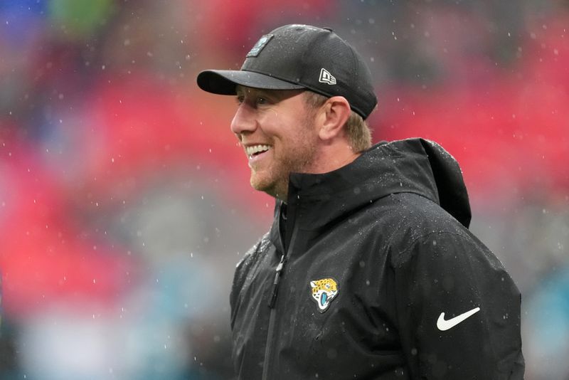 Oct 19, 2025; London, United Kingdom; Jacksonville Jaguars head coach Liam Coen looks on during warmups before a NFL International Series game between the Los Angeles Rams and the Jacksonville Jaguars at Wembley Stadium. Mandatory Credit: Kirby Lee-Imagn Images