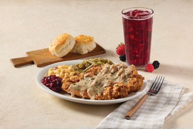 Cracker Barrel's Country Fried Turkey: Hand-breaded tenderloins with herbed pan gravy, shown with Merry Berry Tea.