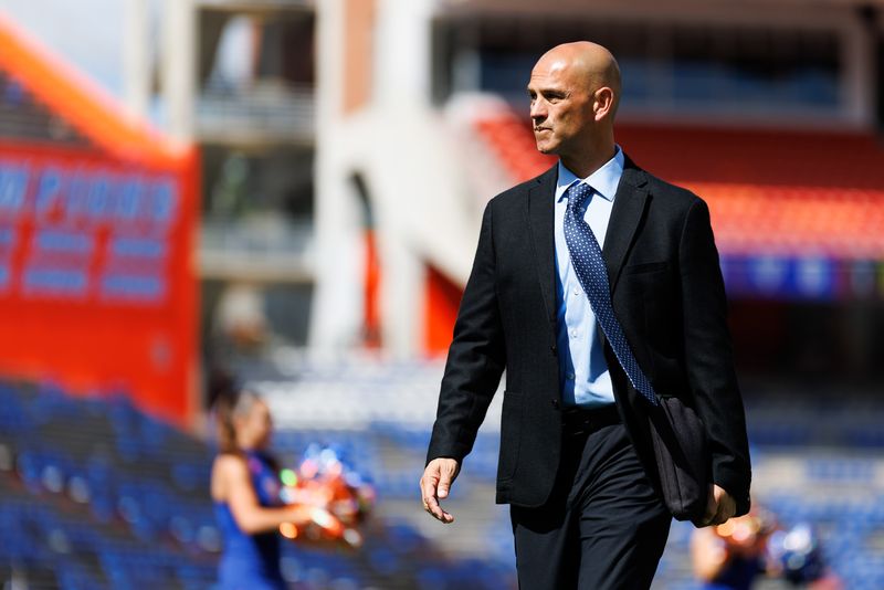 Oct 18, 2025; Gainesville, Florida, USA; Florida Gators assistant coach for wide receivers Billy Gonzales walks on the field during Gator Walk before a game against the Mississippi State Bulldogs at Ben Hill Griffin Stadium. Mandatory Credit: Matt Pendleton-Imagn Images