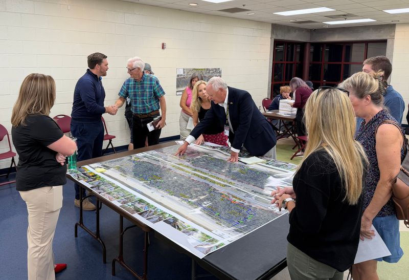 Pensacola Mayor D.C. Reeves talks to attendees at a "listening session" for the reopening of Bay Bluffs Park at the Vickery Community Center on Oct 22, 2025.
