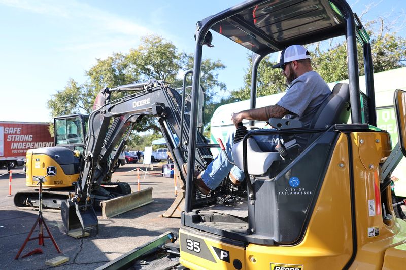 Potential employers illustrate work at their companies at the Third Annual North Florida Worlds of Work career expo. The two-day event took place Oct. 23 and Oct. 24, 2025.