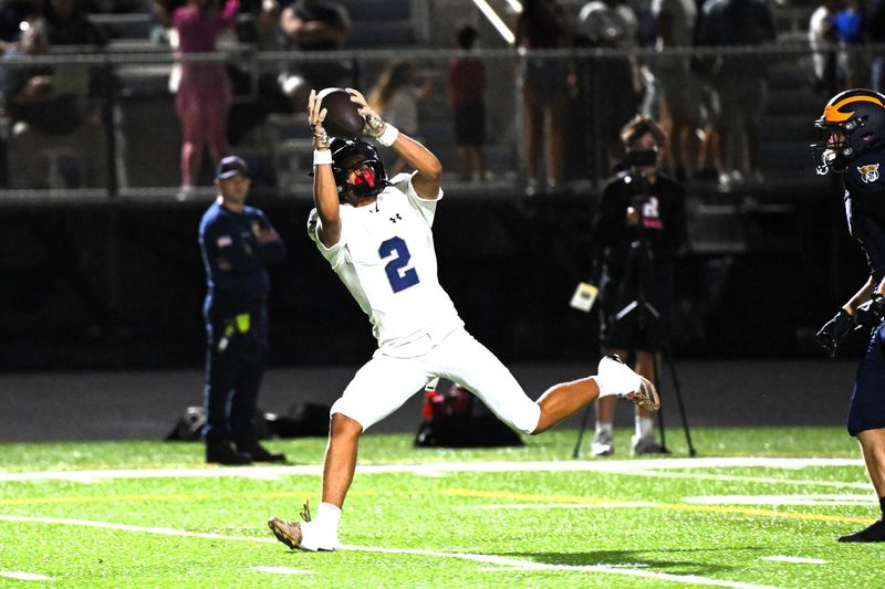 Spanish River's Jayden Elder with a picture perfect over the shoulder catch for a score during a 28-20 district-deciding victory against Boca Raton on Oct. 24, 2025.