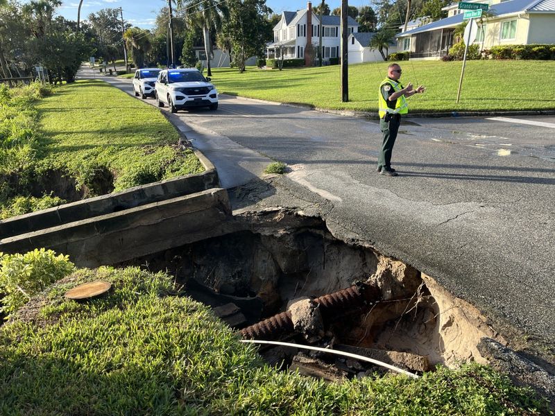 A portion of a street in Cocoa was washed away following severe flooding during a storm the evening of Oct. 26, 2025.