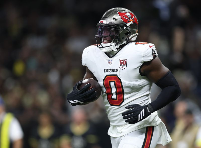 Oct 26, 2025; New Orleans, Louisiana, USA; Tampa Bay Buccaneers linebacker Yaya Diaby (0) runs off the field with the ball during the second quarter against the New Orleans Saints at Caesars Superdome. Mandatory Credit: Stephen Lew-Imagn Images