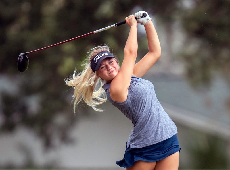 McKeel sophomore Leonie Tavares tees off on Tuesday during the Class 2A, District 9 Girls Golf Tournament at Cypresswood Golf Club.