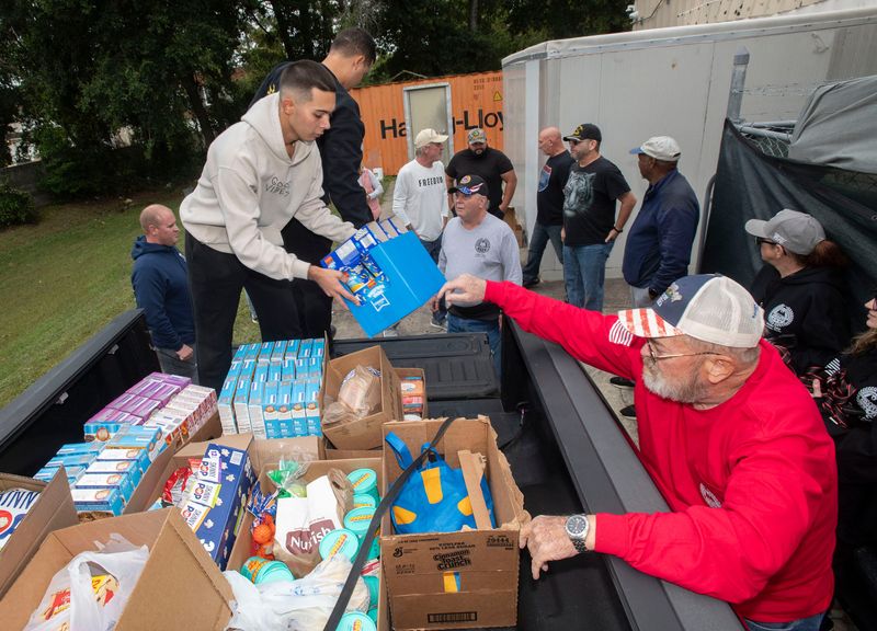 Coast Guard volunteers collect supplies with the help of Costello's Butcher and Deli for Hurricane Melissa evacuees in the area from Guantanamo Bay on Oct. 30, 2025.