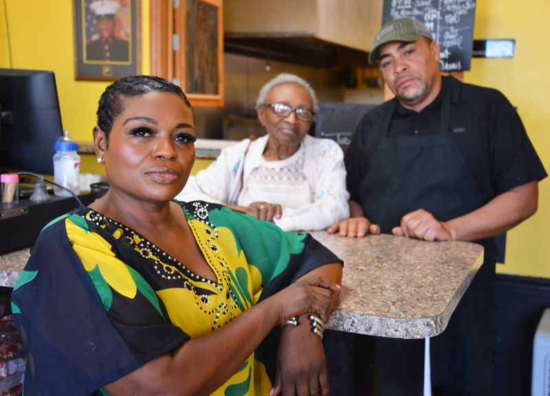 Andrea Morrison, owner of Hazel’s Caribbean Restaurant in Mebourne, is pictured with her husband, Jason, and her mother, Esmena Leadbeater. Morrison, whose family’s vacation home in Jamaica was heavily damaged by Hurricane Melissa, is giving a percentage of her earnings to help the recovery effort in Jamaica.