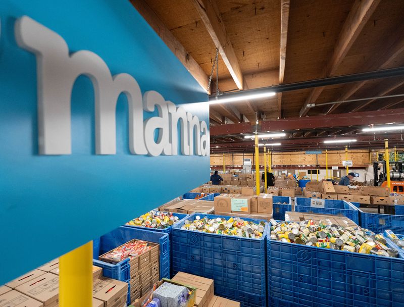 Volunteers sort food at the Manna Food Pantry in Pensacola on Oct. 30, 2025.