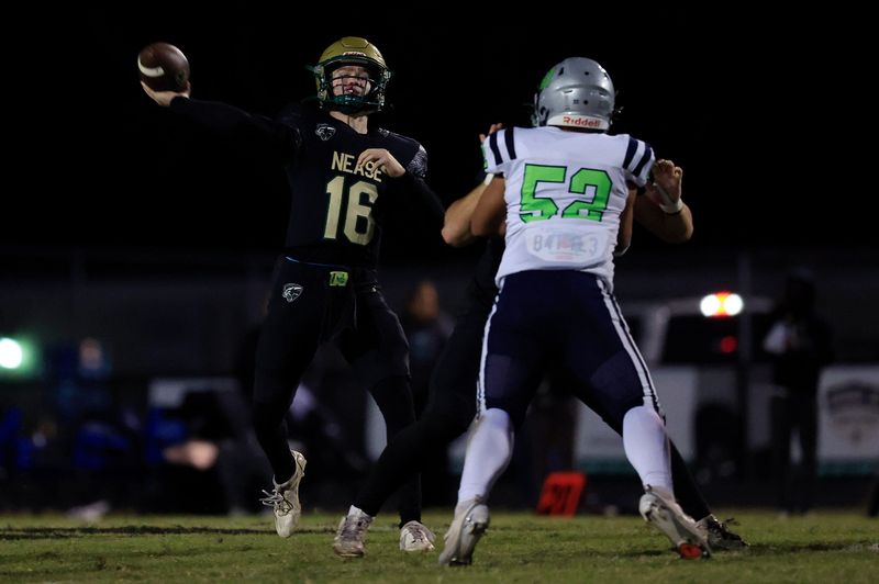 Nease’s Aiden Phifer (16) airs a pass out for a touchdown score during the second quarter a high school football matchup, Thursday, Oct. 30, 2025, in Ponte Vedra Beach, Fla. The Nease Panthers ran past the Beachside Barracudas 47-17.