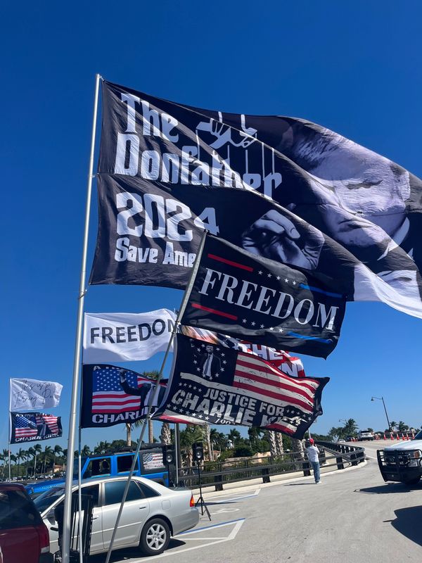 Supporters displayed an array of flags at Bingham Island ahead of President Donald Trump's arrival on Oct. 31.