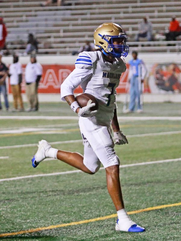 Mainland’s Chris Butler (7) scores a touchdown during the Buccaneers' game against Seabreeze High School at Daytona Stadium on Friday, Oct. 31, 2025.