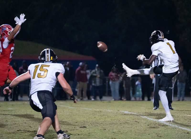 Panthers' David Aboya (1) punts during the Milton-Pace football game at Pace High School on Oct. 31, 2025.