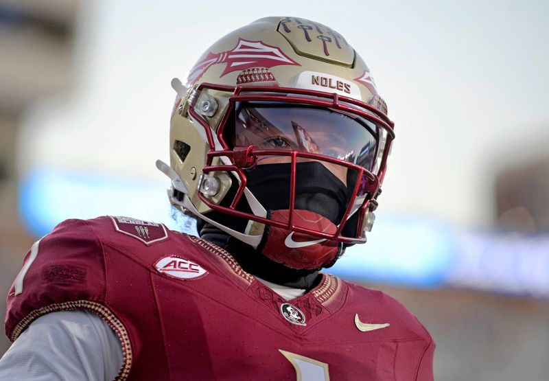 Nov 1, 2025; Tallahassee, Florida, USA; Florida State Seminoles quarterback Tommy Castellanos (1) warms up before the game against the Wake Forest Demon Deacons at Doak S. Campbell Stadium. Mandatory Credit: Melina Myers-Imagn Images