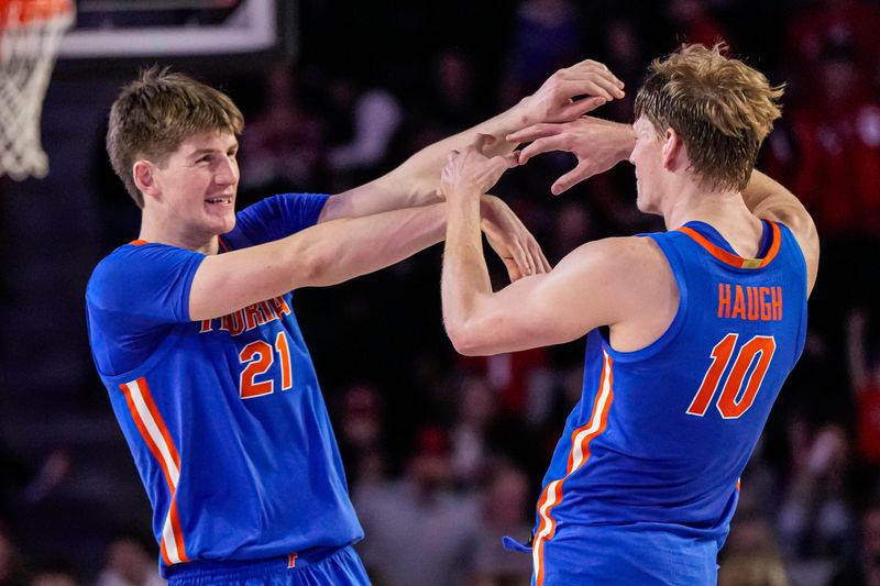 Feb 17, 2024; Athens, Georgia, USA; Florida Gators forwards Alex Condon (21) and Thomas Haugh (10) react after defeating the Georgia Bulldogs at Stegeman Coliseum. Mandatory Credit: Dale Zanine-USA TODAY Sports