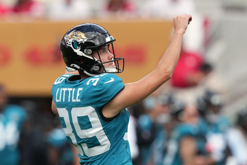 Sep 28, 2025; Santa Clara, California, USA; Jacksonville Jaguars kicker Cam Little (39) follows through after kicking an extra point against the San Francisco 49ers during the second quarter at Levi's Stadium. Mandatory Credit: Darren Yamashita-Imagn Images