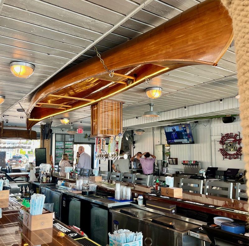 A canoe from the old Doc Ford's on Captiva hangs above the bar at Bonita Fish Company on Fort Myers Beach.
