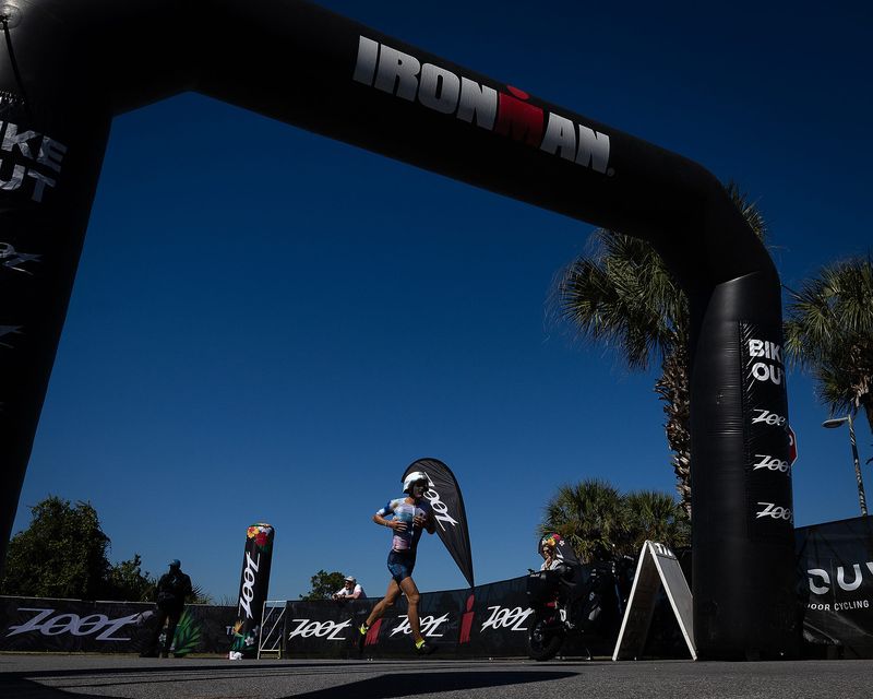 An athlete runs towards the final 26.2-mile running stage of the Visit Panama City Beach IRONMAN Florida triathlon Nov. 1, 2025. (Tyler Orsburn/News Herald)