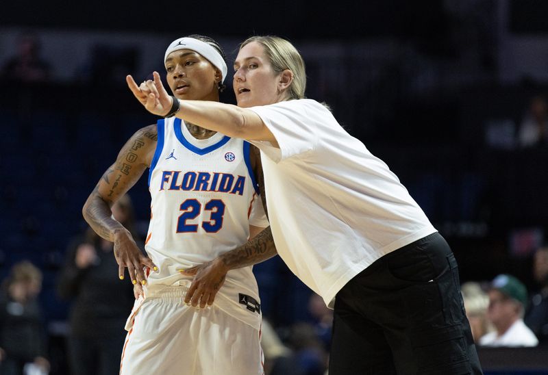 Florida head coach Kelly Rae Finley talks to Florida guard Liv McGill (23) during the second half of an NCAA women’s basketball game at Steven C. O'Connell Center Exactec Arena in Gainesville, FL on Monday, November 3, 2025. [Alan Youngblood/Gainesville Sun]