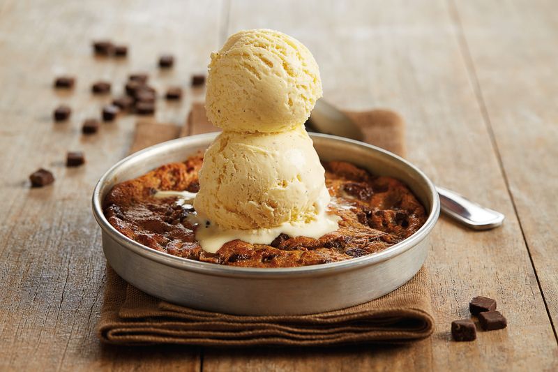 BJ's Restaurants & Brewhouse's Chocolate Chunk Pizookie dessert; veterans and active-duty military who dine in on Veterans Day can get one free.