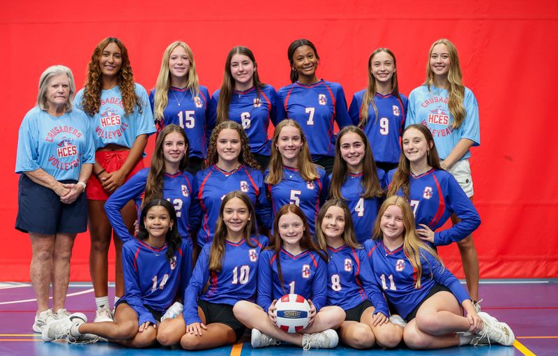 The Holy Comforter volleyball team. Front row, left to right: Pilar Pittman, Lily Harrison, Brynleigh Watson, Hayden Chittenden, Quinn Knipple. Middle row: Eloise Barstow, Sola Brooks, Lilly Munroe, Carlone Santos, Izzy Kosberg. Back row: Coach Joy Becker, Coach Kendaie Greene, Liliana Drygas, Eme Brooks, Phoebe Pittman, Blake Bayliss, Coach Blake Bayliss.