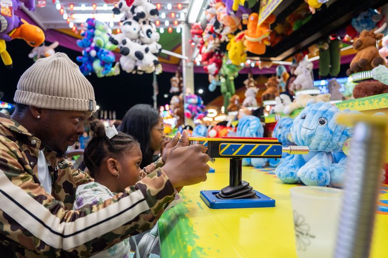 Friends, families and others enjoy rides, games, food and more during opening night of the North Florida Fair on Thursday, Nov. 6, 2025.