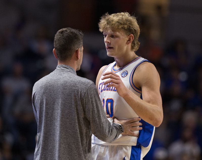 Florida head coach Todd Golden talks with Florida forward Thomas Haugh (10) during the first half of an NCAA basketball game at Steven C. O'Connel Center Exactech Areana in Gainesville, FL on Thursday, November 6, 2025. [Alan Youngblood/Gainesville Sun]