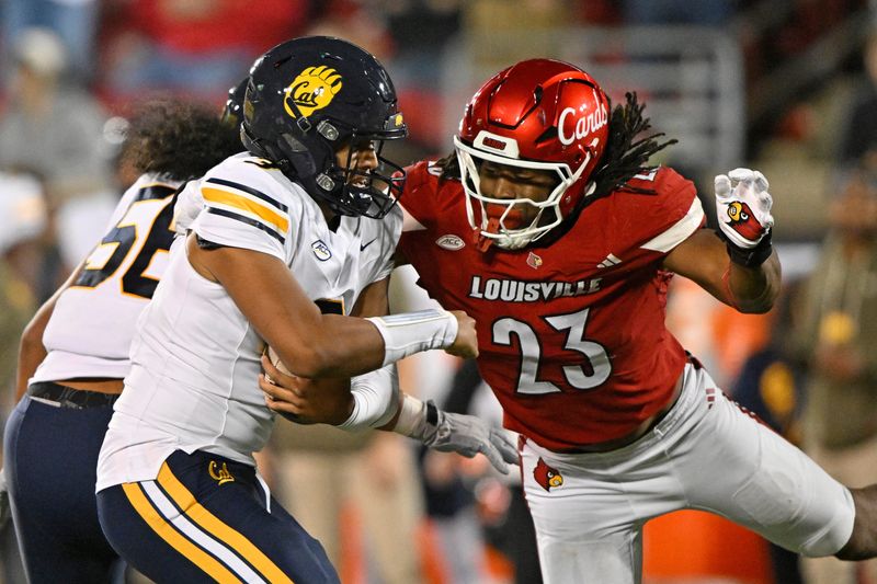 Nov 8, 2025; Louisville, Kentucky, USA; Louisville Cardinals defensive lineman Wesley Bailey (23) sacks California Golden Bears quarterback Jaron-Keawe Sagapolutele (3) during the second half at L&N Federal Credit Union Stadium. California defeated Louisville 29-26. Mandatory Credit: Jamie Rhodes-Imagn Images