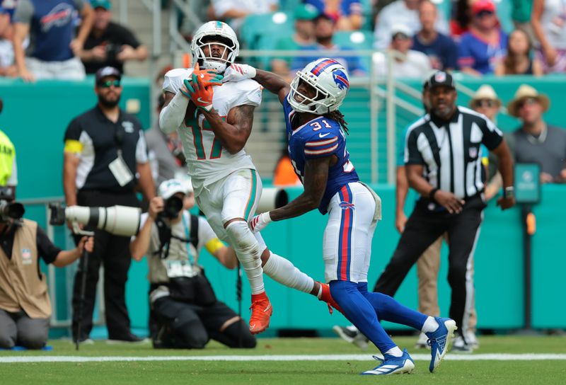 Nov 9, 2025; Miami Gardens, Florida, USA; Miami Dolphins wide receiver Jaylen Waddle (17) makes a touchdown catch against Buffalo Bills cornerback Maxwell Hairston (31) during the first half at Hard Rock Stadium. Mandatory Credit: Sam Navarro-Imagn Images