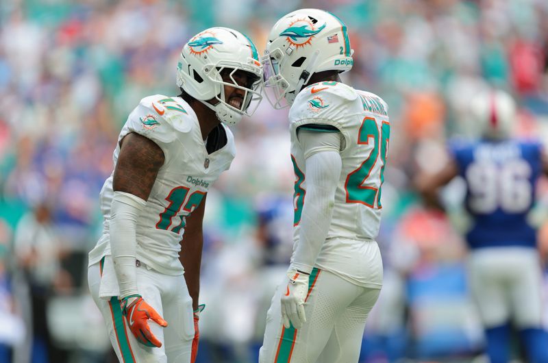 Nov 9, 2025; Miami Gardens, Florida, USA; Miami Dolphins wide receiver Jaylen Waddle (17) celebrates with running back De'Von Achane (28) after a touchdown catch against the Buffalo Bills during the first half at Hard Rock Stadium. Mandatory Credit: Sam Navarro-Imagn Images