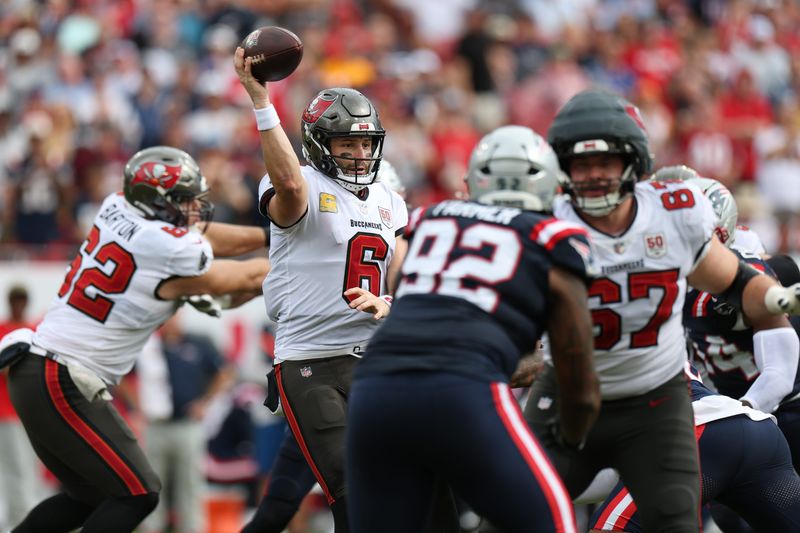 Nov 9, 2025; Tampa, Florida, USA; Tampa Bay Buccaneers quarterback Baker Mayfield (6) throws downfield during the second quarter against the New England Patriots at Raymond James Stadium. Mandatory Credit: Nathan Ray Seebeck-Imagn Images