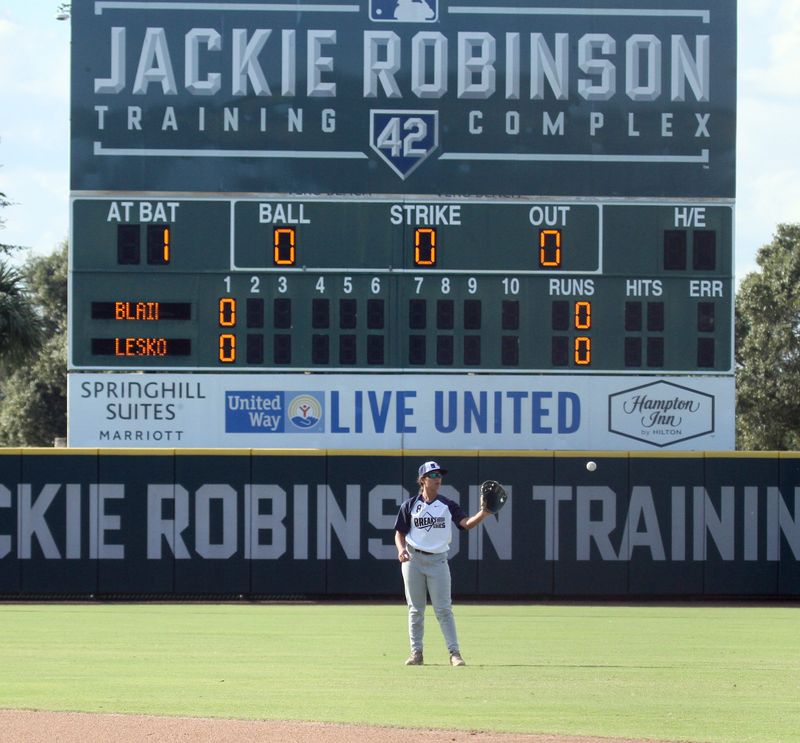 Mia Kruspe warms up in the outfield during the Major League Baseball Girls Baseball Breakthrough Series scrimmage Saturday at the Jackie Robinson Training Complex in Vero Beach.