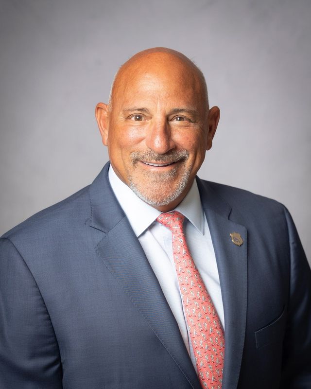 John Kazanjian, president of the Palm Beach County Police Benevolent Association, is seeking to unseat Martin County Commission Chair Sarah Heard in 2026.