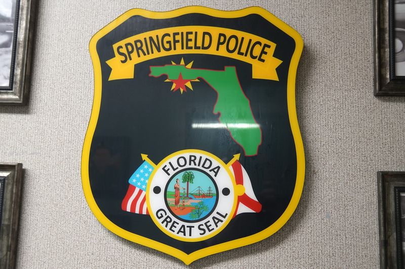 A Springfield Police Department shield hangs from the wall of their police annex on Nov. 12, 2025.