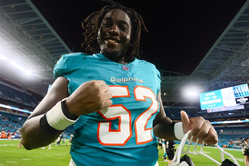 Aug 9, 2024; Miami Gardens, Florida, USA; Miami Dolphins offensive tackle Patrick Paul (52) celebrates after the game against the Atlanta Falcons at Hard Rock Stadium. Mandatory Credit: Sam Navarro-USA TODAY Sports