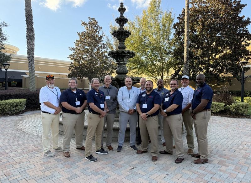 Jacksonville truck drivers Miguel Sanchez, second from left, and Demetrius "Dee" Hastings, fourth from right, were selected for the Florida Trucking Association's Florida Road Team that serves as industry ambassadors;