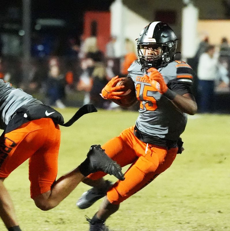 Spruce Creek’s DJ Culley (15) avoids being tackled during the game against Seminole High School hosted by Spruce Creek, Friday, Nov. 14, 2025.