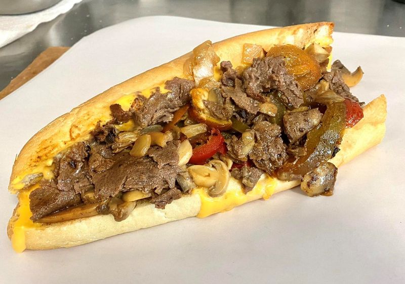 “Some people go to therapy, we just add extra cheese,” reads the caption of this photo posted on the Johnny Longhots and Steaks Sarasota (formerly Gentile’s Cheesesteaks) Facebook page on May 31, 2025.