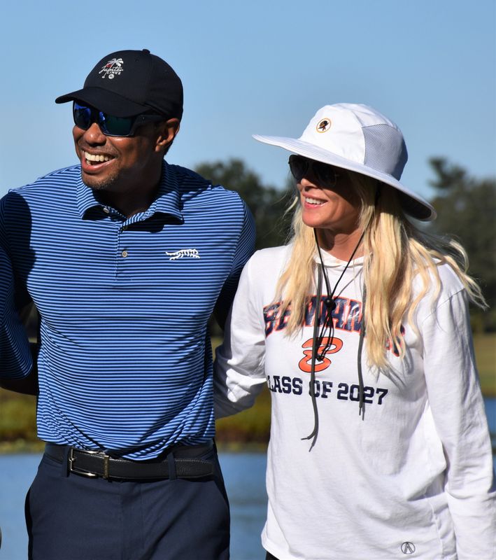 Tiger Woods and Elin Nordegren line up with Benjamin golfers and parents, wearing big smiles as they celebrate the Class 1A state championship on Nov. 15, 2025.