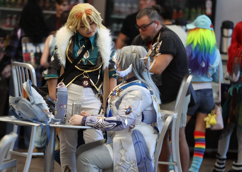 Visitors relax in the lounge during Infinity Con at the Alachua County Sports and Events Center.