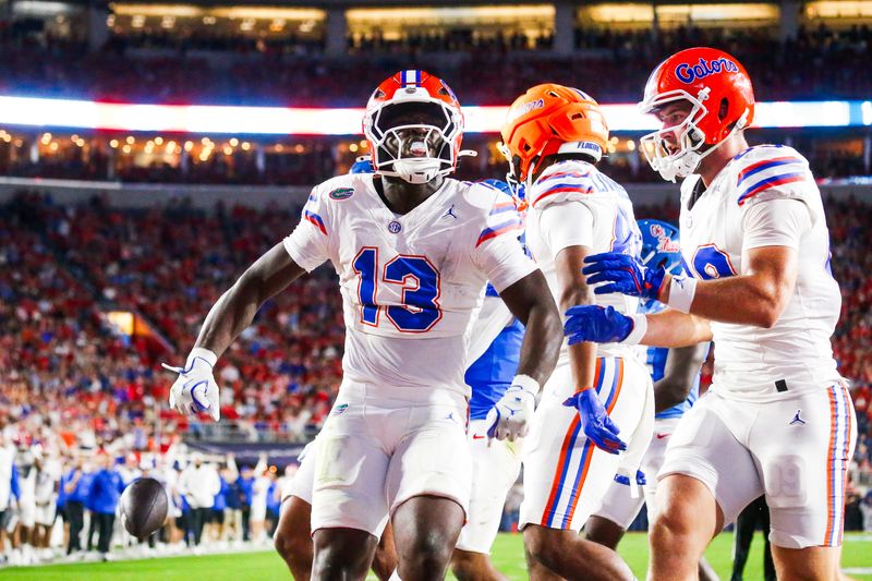 Nov 15, 2025; Oxford, Mississippi, USA; Florida Gators running back Jadan Baugh (13) celebrates with tight end Hayden Hansen (89) after rushing for a touchdown against the Mississippi Rebels during the second quarter at Vaught-Hemingway Stadium. Mandatory Credit: Petre Thomas-Imagn Images