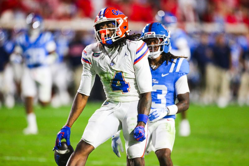 Nov 15, 2025; Oxford, Mississippi, USA; Florida Gators wide receiver TJ Abrams (4) reacts after catching pass against the Mississippi Rebels during the first quarter at Vaught-Hemingway Stadium. Mandatory Credit: Petre Thomas-Imagn Images