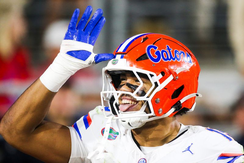 Nov 15, 2025; Oxford, Mississippi, USA; Florida Gators defensive lineman Jayden Woods (15) celebrates following an interception against the Mississippi Rebels during the first quarter at Vaught-Hemingway Stadium. Mandatory Credit: Petre Thomas-Imagn Images