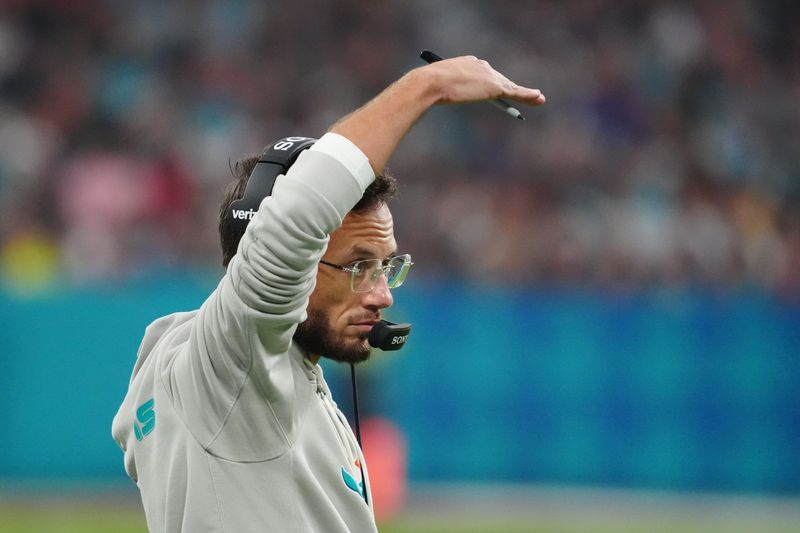 Nov 16, 2025; Madrid, Spain; Miami Dolphins head coach Mike McDaniel looks on in the first quarter during the 2025 NFL Madrid Game against the Washington Commanders at Santiago Bernabeu Stadium. Mandatory Credit: Kirby Lee-Imagn Images