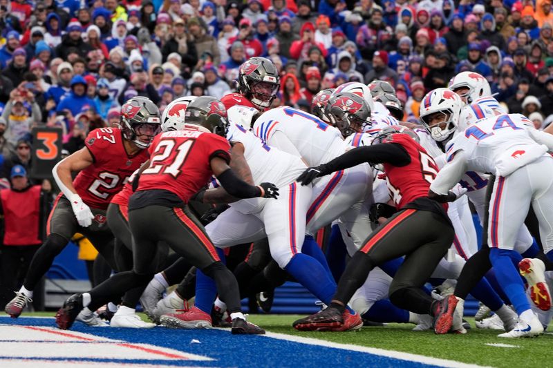 Buffalo Bills quarterback Josh Allen runs for a touchdown against the Tampa Bay Buccaneers during the first quarter of the game at Highmark Stadium.