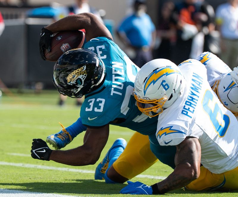 Jacksonville Jaguars running back Bhayshul Tuten (33) dives across the goal line for a touchdown in the first quarter in an NFL football game at EverBank Stadium, Sunday, November 16, 2025, in Jacksonville, Fla. [Doug Engle/Florida Times-Union]