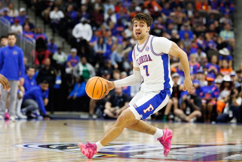 Nov 16, 2025; Jacksonville, Florida, USA; Florida Gators guard Urban Klavzar (7) dribbles the ball against the Miami Hurricanes during the first half at VyStar Veterans Memorial Arena. Mandatory Credit: Matt Pendleton-Imagn Images