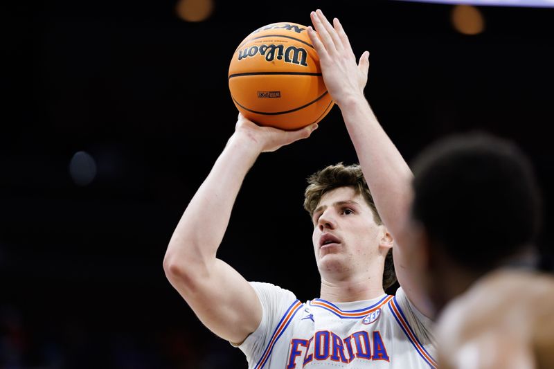 Nov 16, 2025; Jacksonville, Florida, USA; Florida Gators forward Alex Condon (21) shoots the ball against the Miami Hurricanes during the first half at VyStar Veterans Memorial Arena. Mandatory Credit: Matt Pendleton-Imagn Images