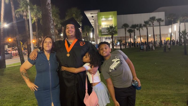 Members of the Asiel family, with children, Ahziah, second from right, and King, far right, who attend Food Brings Hope's KidsZone, an after-school tutoring program that provides food and a safe place for students to learn.