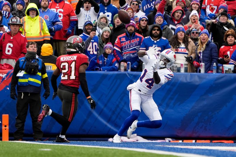 Nov 16, 2025; Orchard Park, New York, USA; Buffalo Bills wide receiver Tyrell Shavers (14) makes a touchdown catch against Tampa Bay Buccaneers cornerback Benjamin Morrison (21) during the first half of the game at Highmark Stadium. Mandatory Credit: Gregory Fisher-Imagn Images